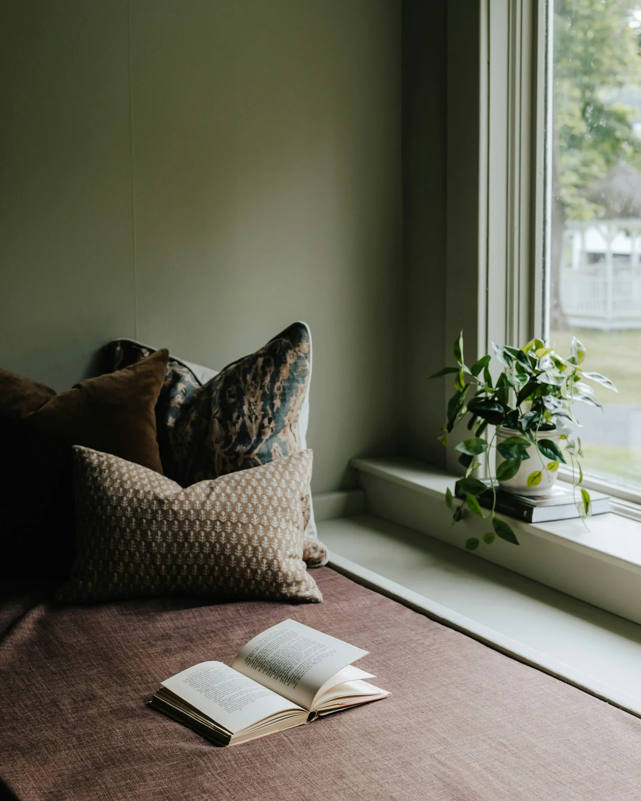 A peaceful reading corner beside a window